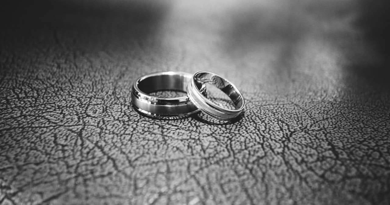 gray shot of two wedding rings